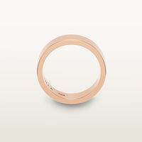A minimalist 18k rose gold band with a flat profile and 90 degree edge, engraved with “SULA 18K” on the inside.