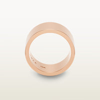 A bold, cigar band-style ring in 18k rose gold with a wide, flat-edge profile and minimalist silhouette, engraved with “SULA 18K” on the inside.