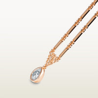 A delicate 18k rose gold necklace  with elongated textured links, an ornate vintage-style bail, and a bezel-set pear-shaped diamond pendant.