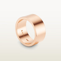 A bold, cigar band-style ring in 18k rose gold with a wide, flat-edge profile and minimalist silhouette, engraved with “SULA 18K” on the inside.
