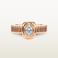 A gold 18k rose gold ring featuring a textured band and bezel-set white diamond. 