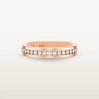 An 18k rose gold eternity band featuring round brilliant diamonds in a sleek channel setting, engraved with “18K” on the inside.