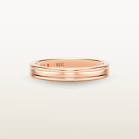 A refined 18k rose gold band with a faded channel setting, engraved with “SULA 18K” on the inside.