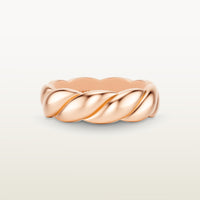 A sculptural 18k rose gold band with a shea-shell, robe-like form and scalloped interior. 