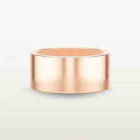 A bold, cigar band-style ring in 18k rose gold with a wide, flat-edge profile and minimalist silhouette.