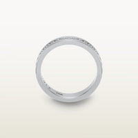 An 18k white gold eternity band featuring round brilliant diamonds in a sleek channel setting, engraved with “SULA 18K” on the inside.