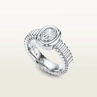 A gold 18k white gold ring featuring a textured band and bezel-set white diamond. 