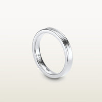 A refined 18k white gold band with a faded channel setting, engraved with “SULA 18K” on the inside.