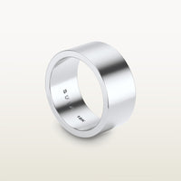 A bold, cigar band-style ring in 18k white gold with a wide, flat-edge profile and minimalist silhouette, engraved with “SULA 18K” on the inside.