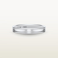 A refined 18k white gold band with a faded channel setting, engraved with “SULA 18K” on the inside.