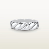 A sculptural 18k white gold band with a shea-shell, robe-like form and scalloped interior. 