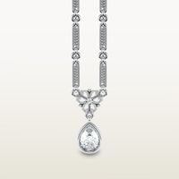 A delicate 18k white gold necklace  with elongated textured links, an ornate vintage-style bail, and a bezel-set pear-shaped diamond pendant.