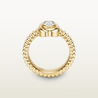 A gold 18k yellow gold ring featuring a textured band and bezel-set white diamond. 
