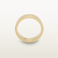 A minimalist 18k yellow gold band with a flat profile and 90 degree edge, engraved with “SULA 18K” on the inside.