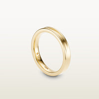 A refined 18k yellow gold band with a faded channel setting, engraved with “SULA 18K” on the inside.