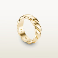 A sculptural 18k yellow gold band with a shea-shell, robe-like form and scalloped interior, engraved with “SULA 18K” on the inside.