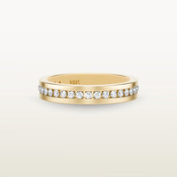 An 18k yellow gold eternity band featuring round brilliant diamonds in a sleek channel setting, engraved with “18K” on the inside.