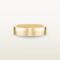 A minimalist 18k yellow gold band with a flat profile and 90 degree edge. 